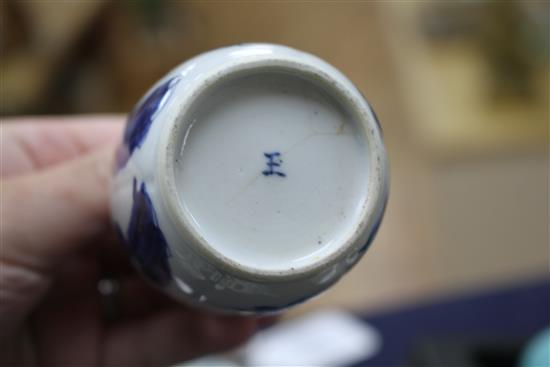 A Chinese blue and white tea bowl and saucer and two jars, Kangxi, some damage, largest diameter 11cm